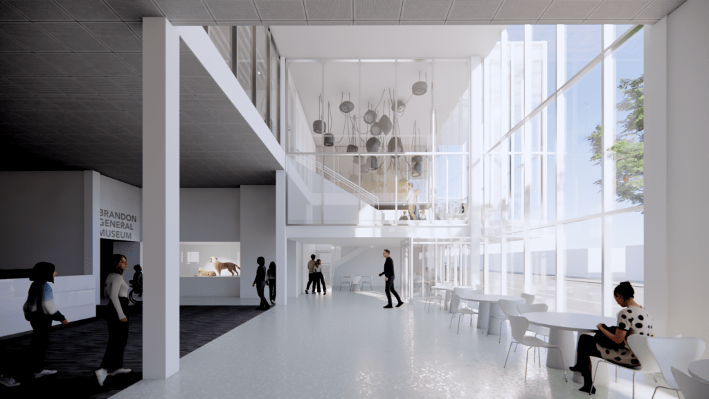 Rendering look at a spacious atrium with patrons walking in the distance. Curtain wall of windows can be seen, giving light to the space. Can see a mezzanine in the background with an art exhibit hanging from the ceiling.