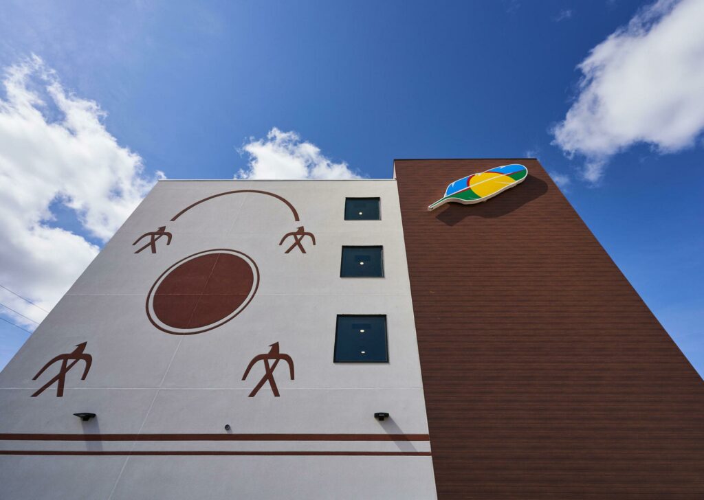 Side of building with Indigenous mural